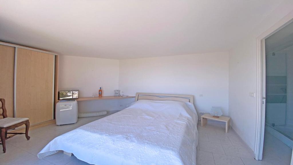 Tempat tidur dalam kamar di Villa Lisuzem