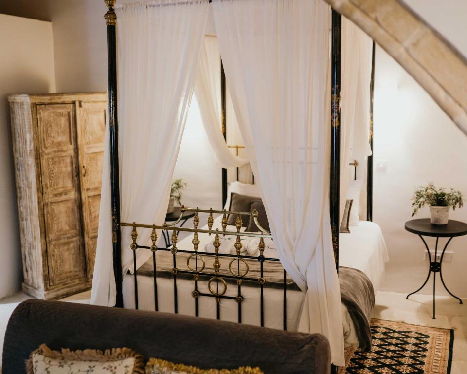 Postel nebo postele na pokoji v ubytování Apanemia Inn Studio