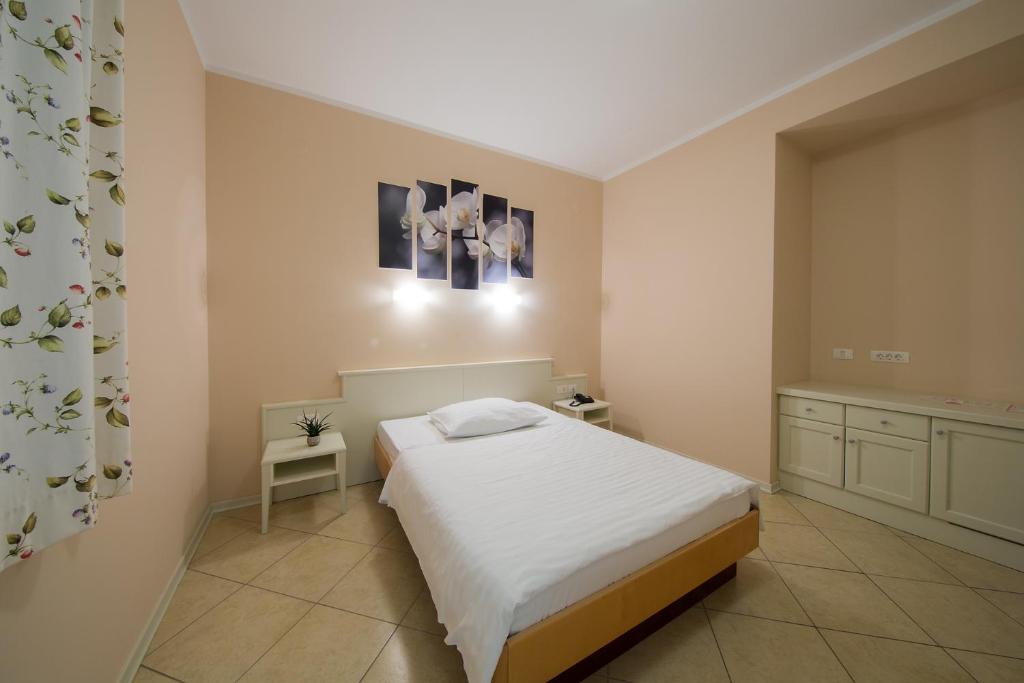 Postel nebo postele na pokoji v ubytování Hotel Kozana