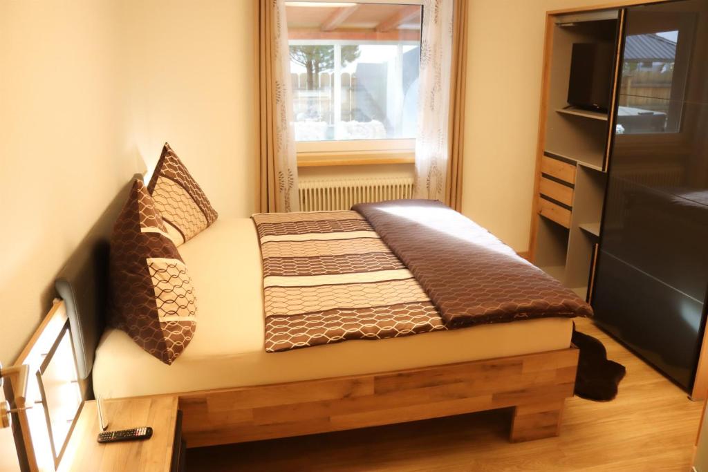 Postel nebo postele na pokoji v ubytování Ferienwohnung am Waldweg