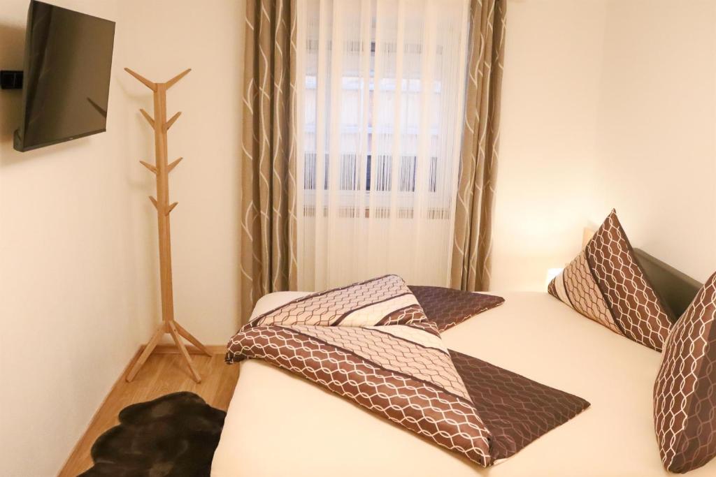 Postel nebo postele na pokoji v ubytování Ferienwohnung am Waldweg