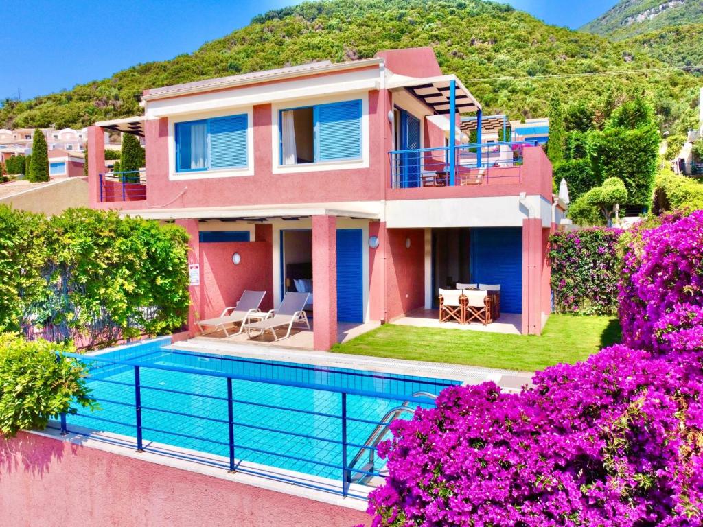 a villa with a swimming pool and a house at Villa Barbati Pelagos with private pool by DadoVillas in Barbati
