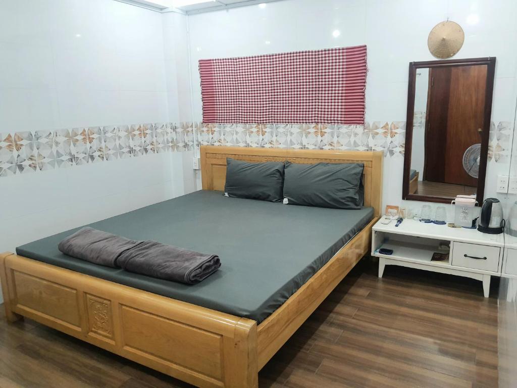 Postel nebo postele na pokoji v ubytování Homestay Khoa Chaudoc