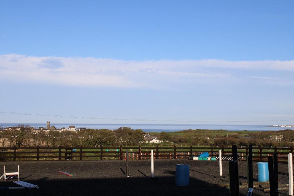 a view of the ocean from the balcony of a house at Sea View Studio in Castlerock