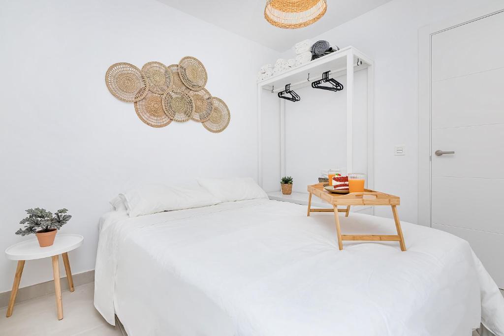 A bed or beds in a room at BHost - Waikiki