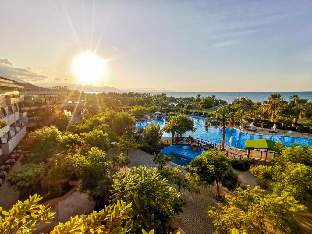 an aerial view of the pool at the resort at Grand Palladium Sicilia Resort & Spa in Campofelice di Roccella