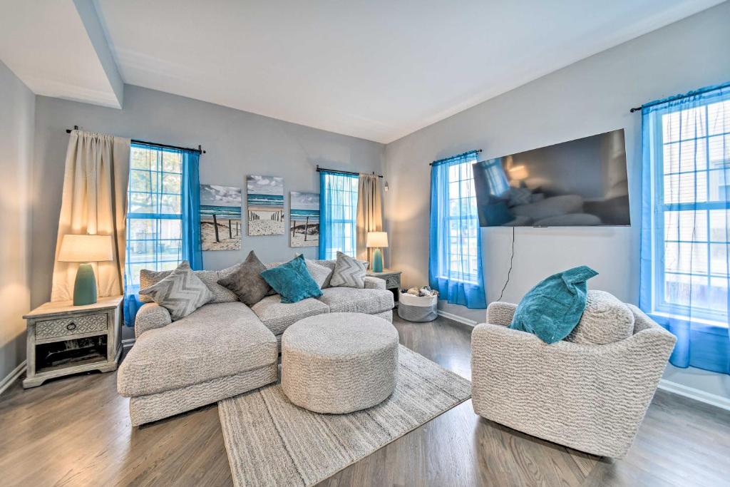 a living room with a couch and two chairs at Bright Norfolk Home with Deck Less Than 3 Mi to Town! in Norfolk