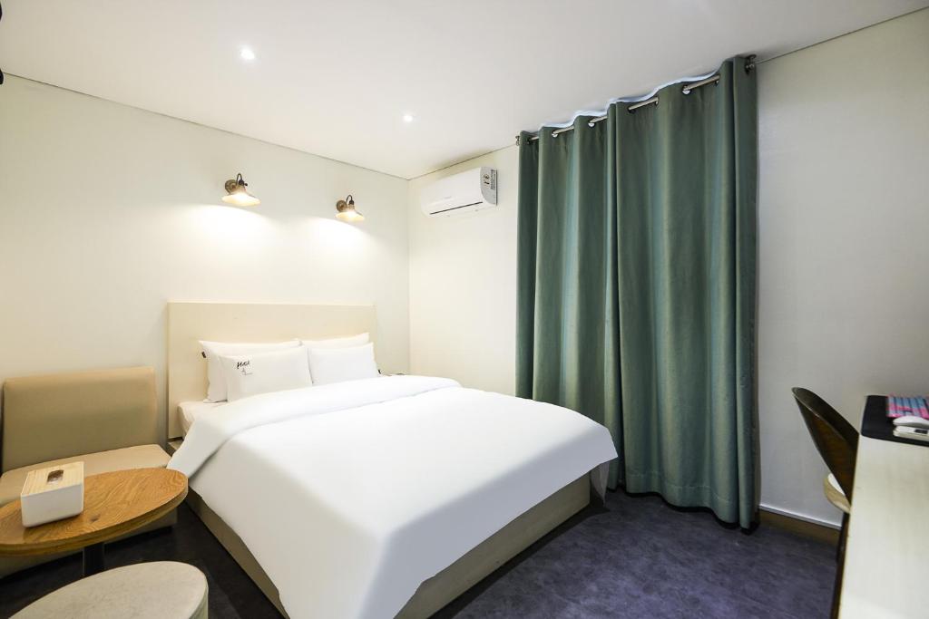 Postel nebo postele na pokoji v ubytování Laria Hotel