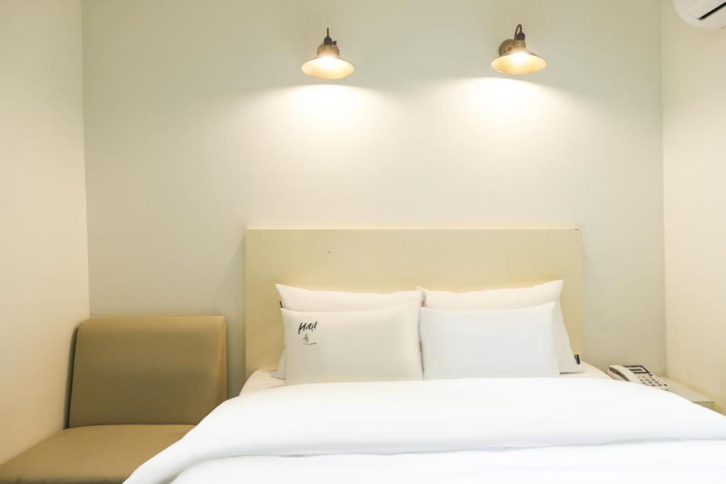 Postel nebo postele na pokoji v ubytování Laria Hotel
