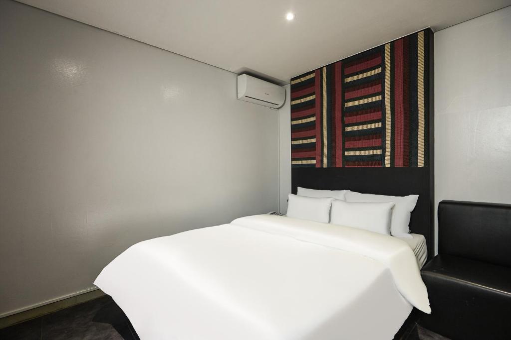 Postel nebo postele na pokoji v ubytování Laria Hotel
