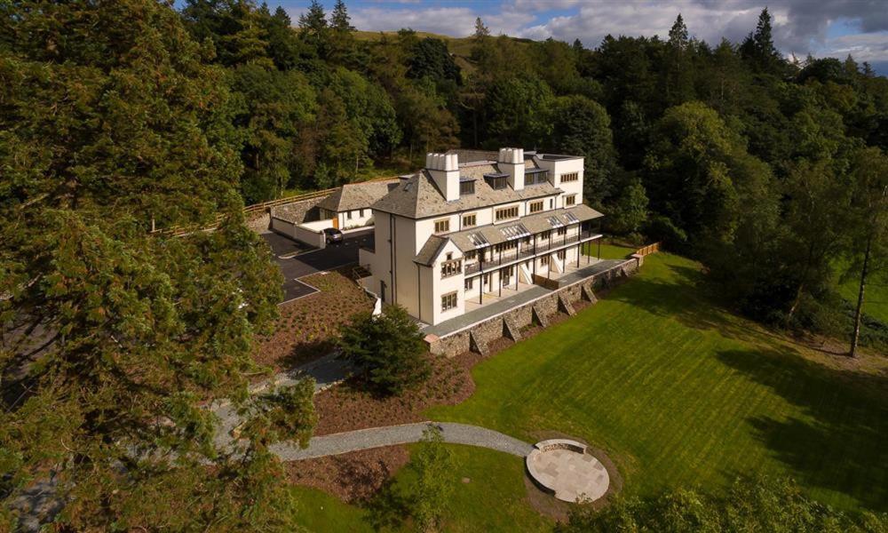 an aerial view of a large house in the woods at Deer Wood at Applethwaite Hall in Windermere