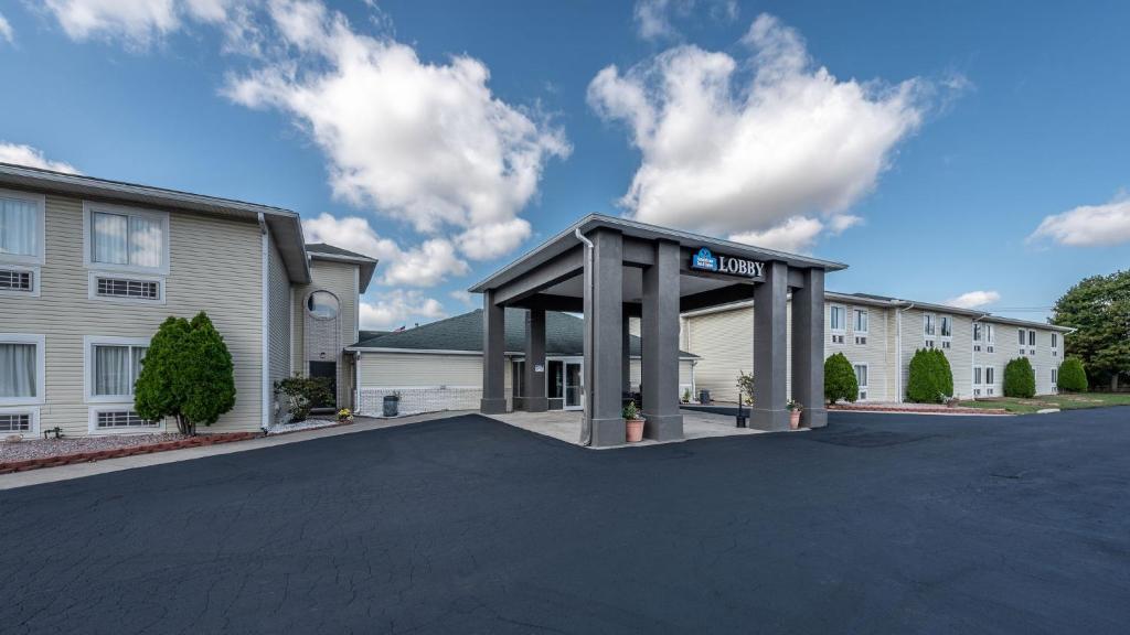 a parking lot in front of a building at American Inn & suites in Dundee