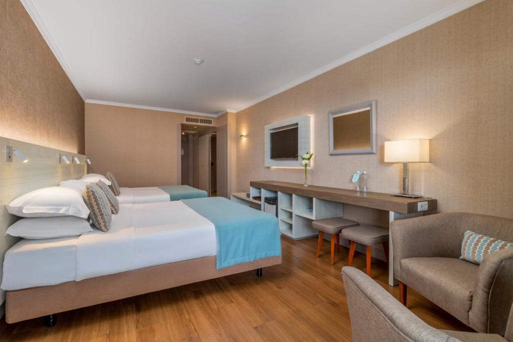 Postel nebo postele na pokoji v ubytování Enotel Lido - All Inclusive