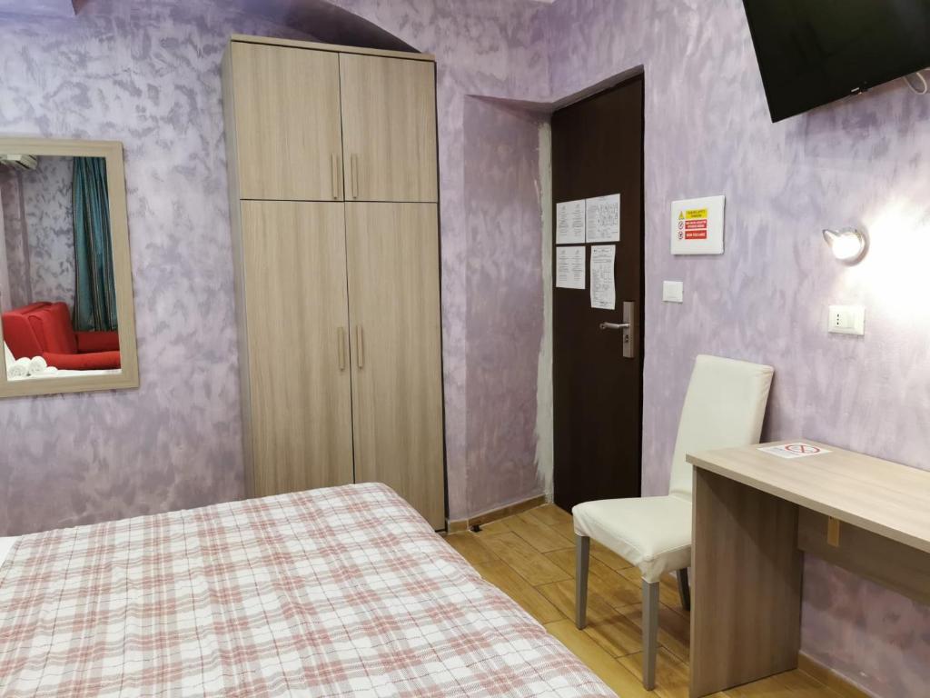 A bed or beds in a room at Hotel Orchidea