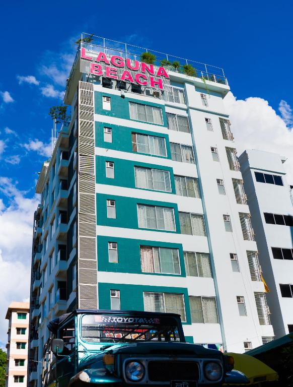 a building with a car parked in front of it at Laguna Beach Hotel & Resort in Cox's Bazar