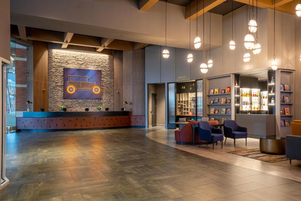 a lobby of a library with a picture of a car on the wall at Hollywood Casino at Greektown in Detroit