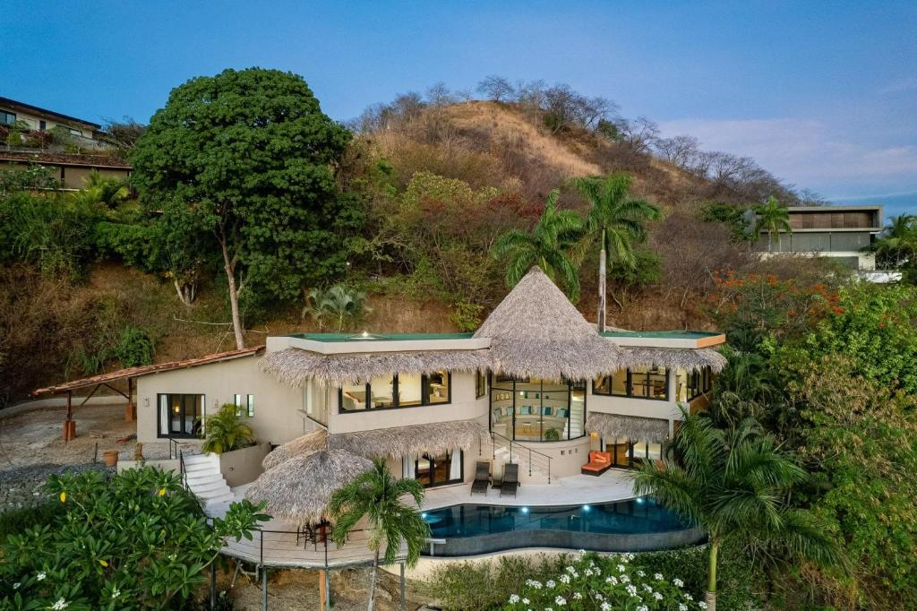 an aerial view of a house with a swimming pool at Villa los Sueños at Playa Flamingo in Potrero