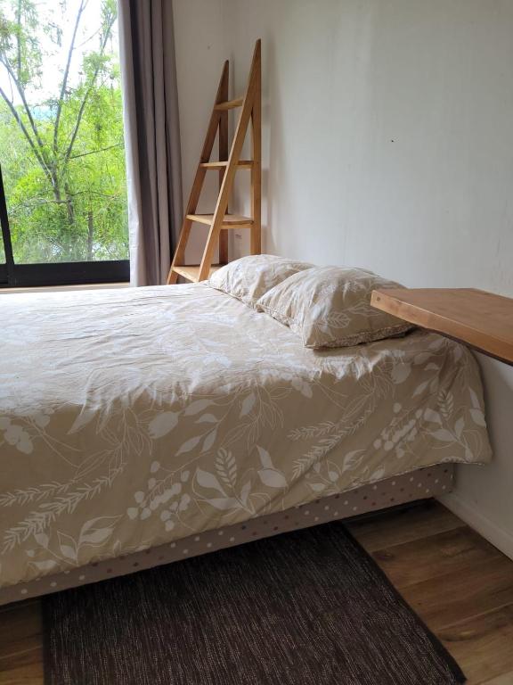 Postel nebo postele na pokoji v ubytování Cabañas Llifenativo