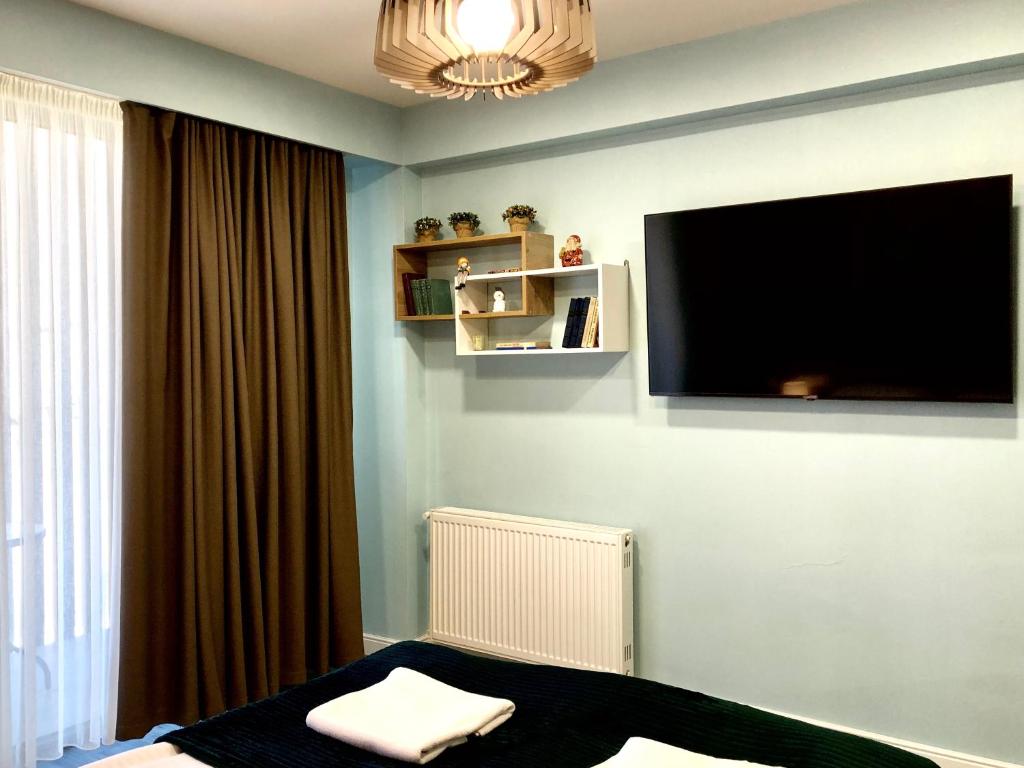 TV a/nebo společenská místnost v ubytování 2-room Apartment NFT New Gudauri Atrium Suite