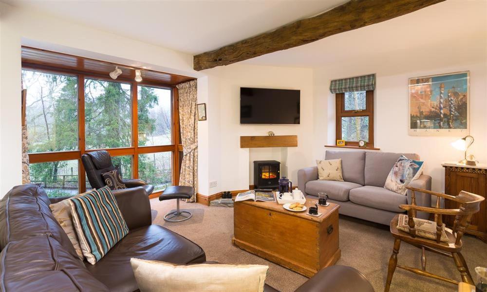 a living room with a couch and a table at Drystones in Grasmere