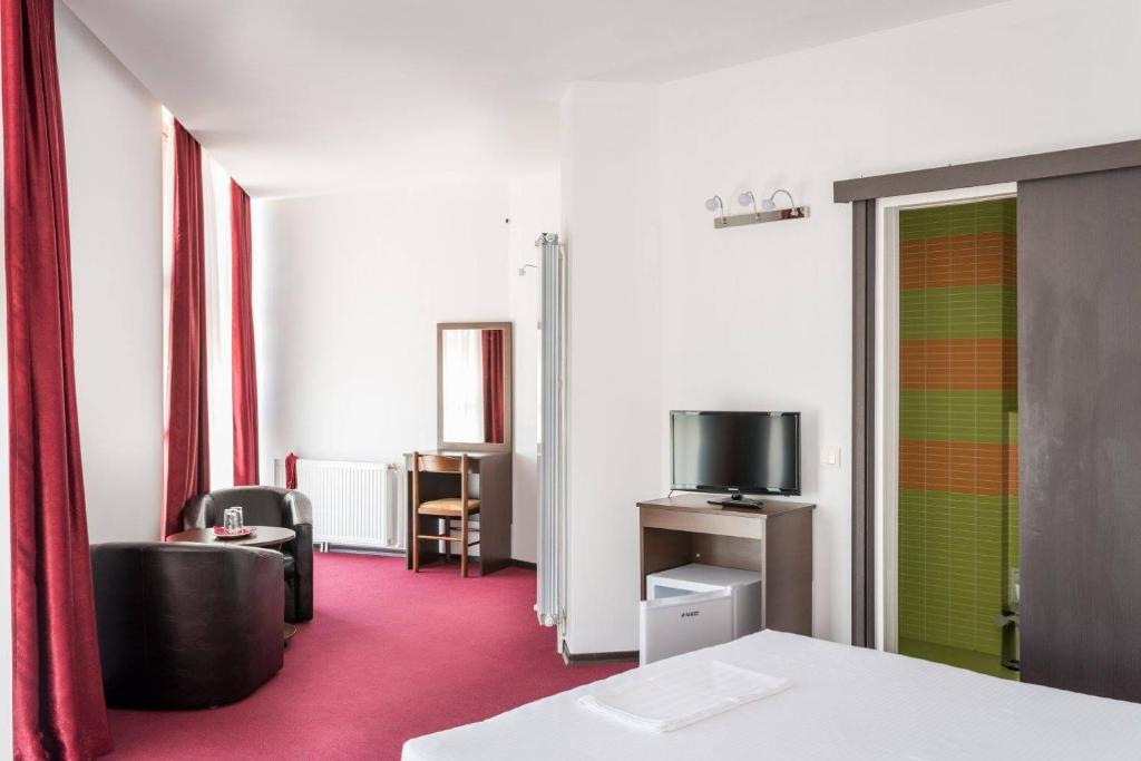 TV a/nebo společenská místnost v ubytování Live Tulcea Hotel