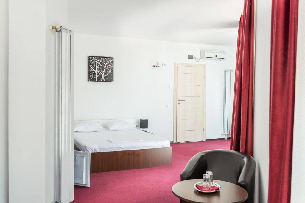 Postel nebo postele na pokoji v ubytování Live Tulcea Hotel