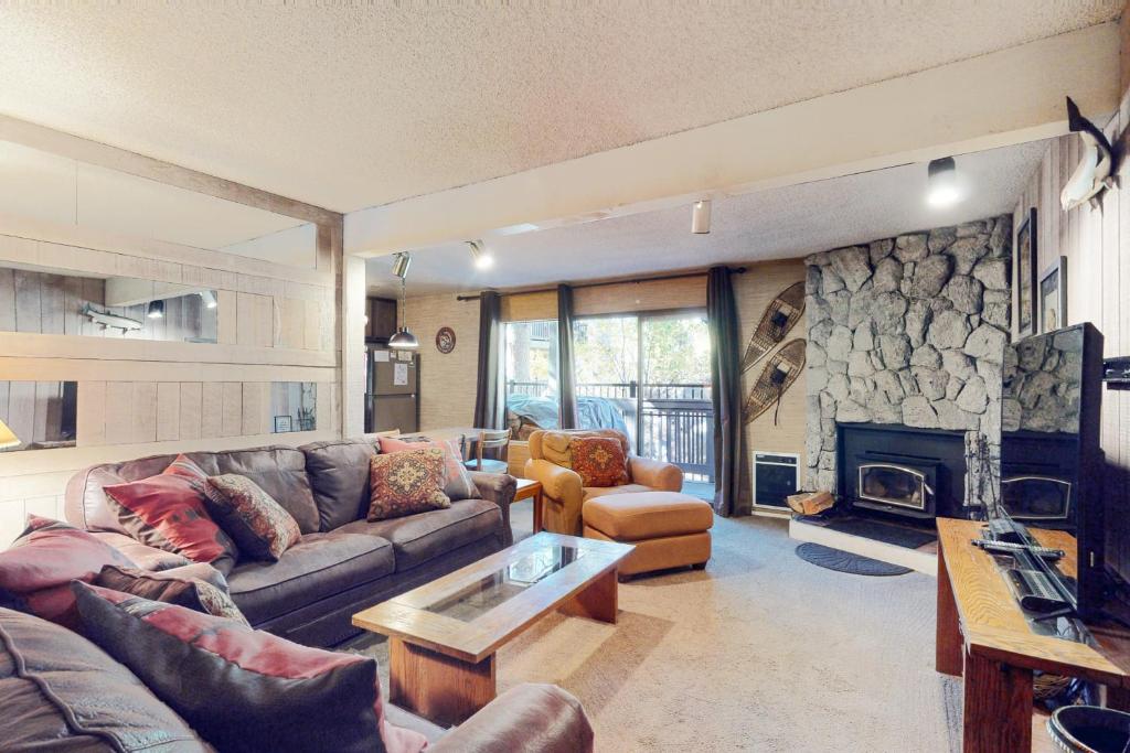a living room with a couch and a fireplace at Sherwin Villas 12 B in Mammoth Lakes
