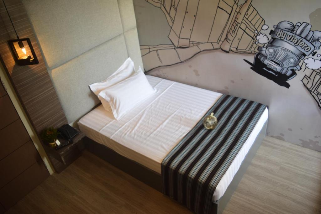 Postel nebo postele na pokoji v ubytování Dy Viajero Transient Hotel