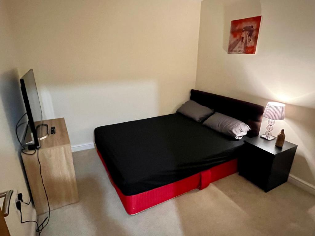 Cama ou camas em um quarto em Homely Flat in Camberley