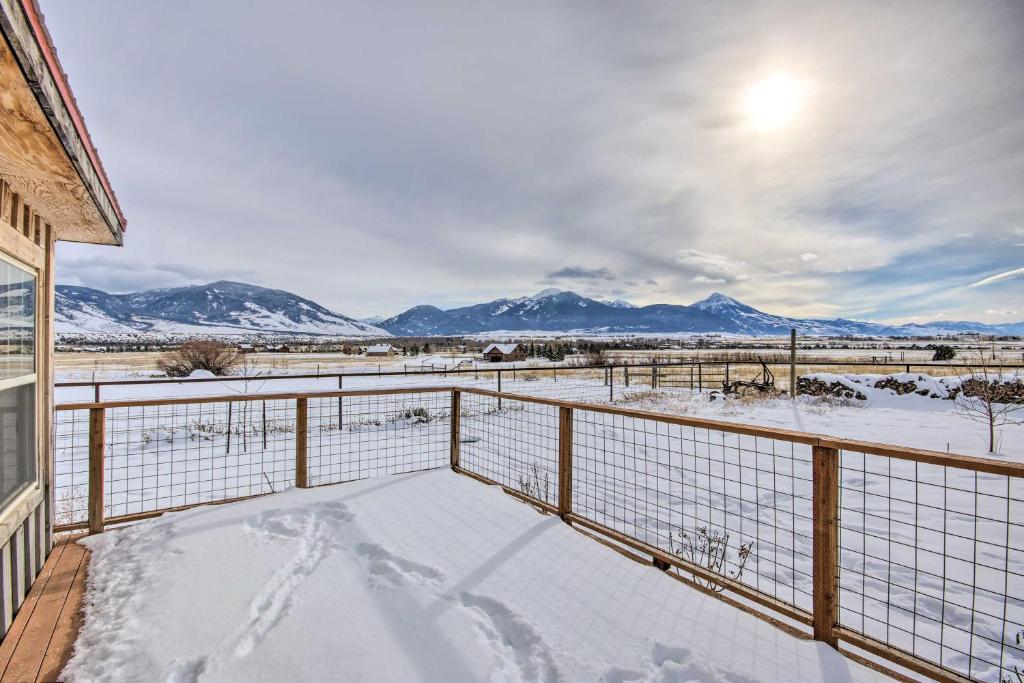 a winter view of mountains from the balcony of a house at Picturesque Cabin Less Than 1 Mi to Yellowstone River in Livingston