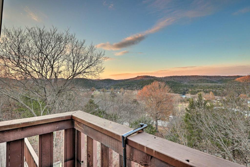 a deck with a view of the mountains at Holiday Island Escape with Panoramic Lake Views in Holiday Island