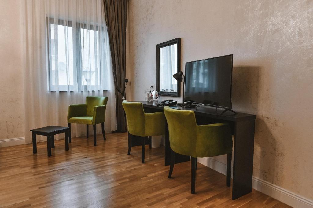 TV a/nebo společenská místnost v ubytování Garni hotel BARUT