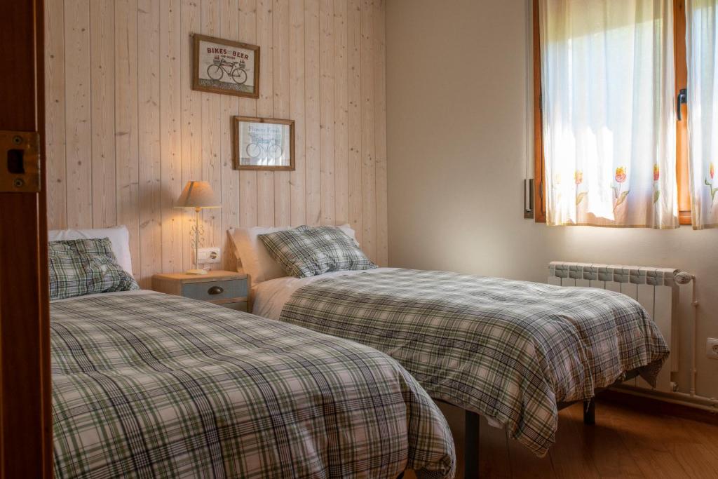 Postel nebo postele na pokoji v ubytování Apartament Cadí- Moixeró