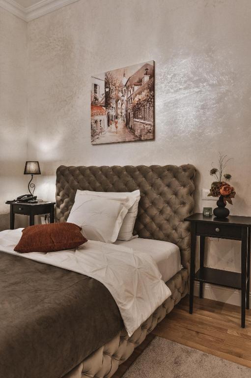 Postel nebo postele na pokoji v ubytování Garni hotel BARUT