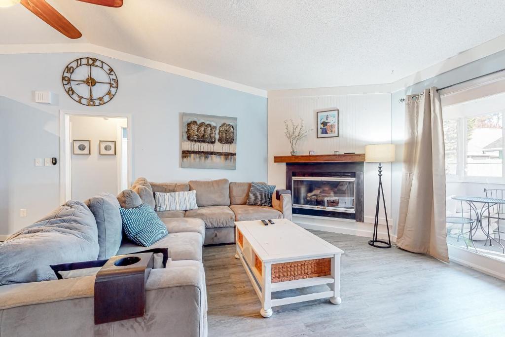 a living room with a couch and a fireplace at The Sand Dune in Ocean City