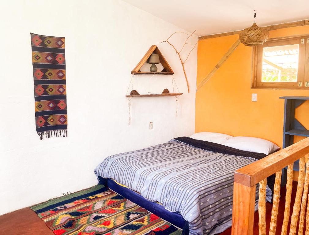 En eller flere senge i et værelse på Granja Tzikin