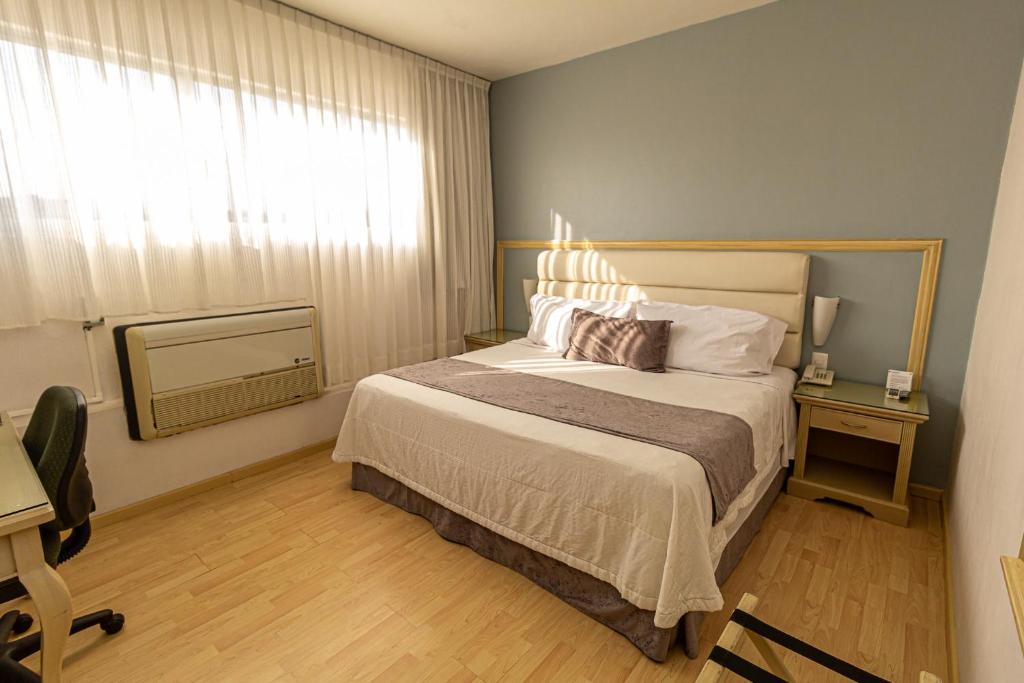 Postel nebo postele na pokoji v ubytování Hoteles Piedra Alta by De Los Perez
