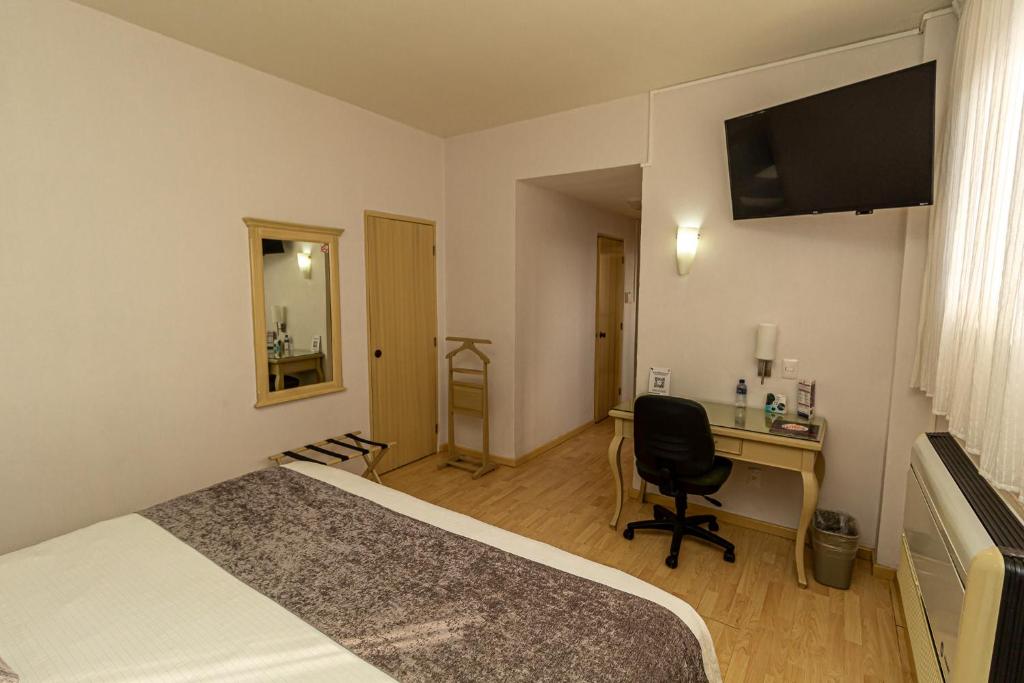 TV a/nebo společenská místnost v ubytování Hoteles Piedra Alta by De Los Perez