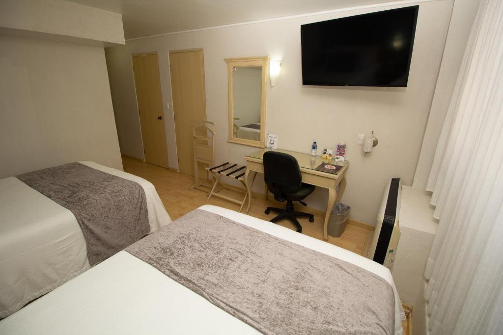 TV a/nebo společenská místnost v ubytování Hoteles Piedra Alta by De Los Perez