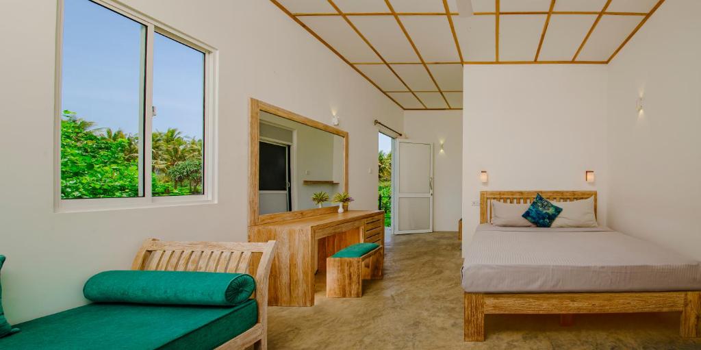 Postel nebo postele na pokoji v ubytování Jungle Beach Ahungalla