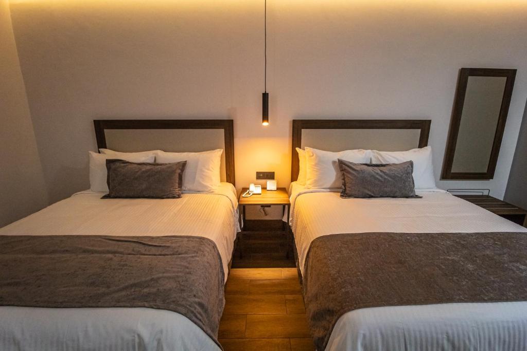 Postel nebo postele na pokoji v ubytování Hoteles Piedra Alta by De Los Perez