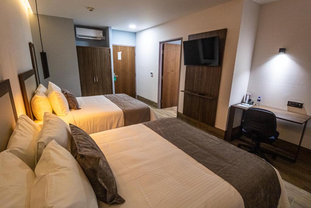 Postel nebo postele na pokoji v ubytování Hoteles Piedra Alta by De Los Perez