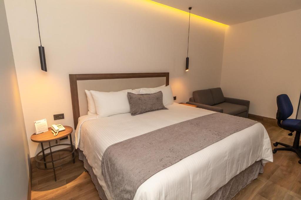 Postel nebo postele na pokoji v ubytování Hoteles Piedra Alta by De Los Perez
