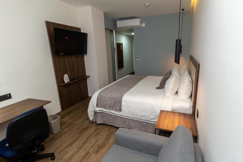 Postel nebo postele na pokoji v ubytování Hoteles Piedra Alta by De Los Perez