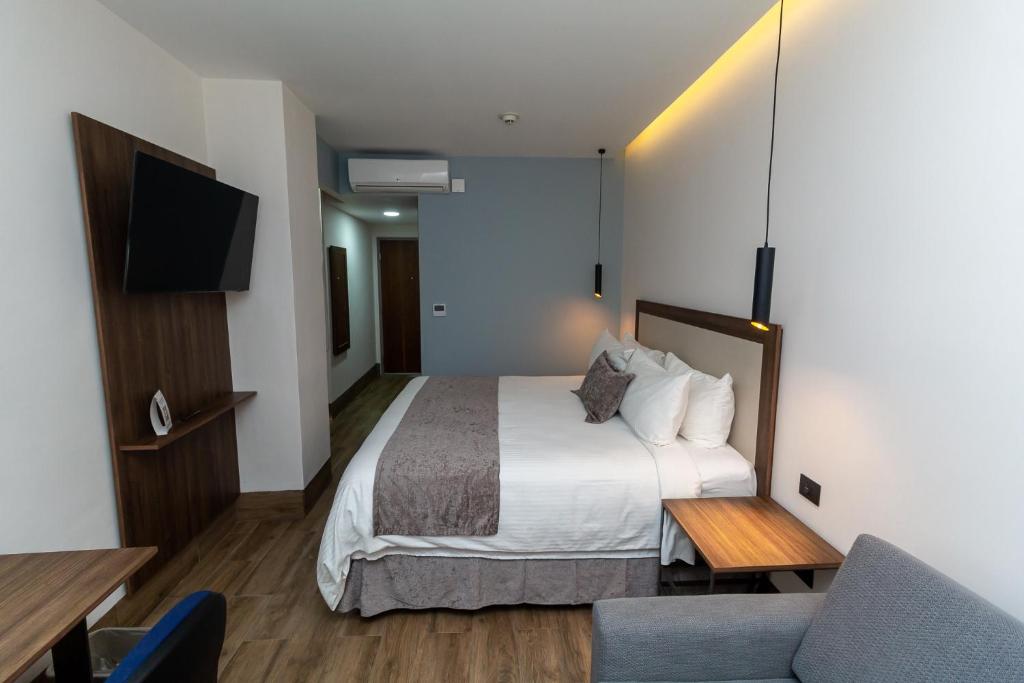 Postel nebo postele na pokoji v ubytování Hoteles Piedra Alta by De Los Perez