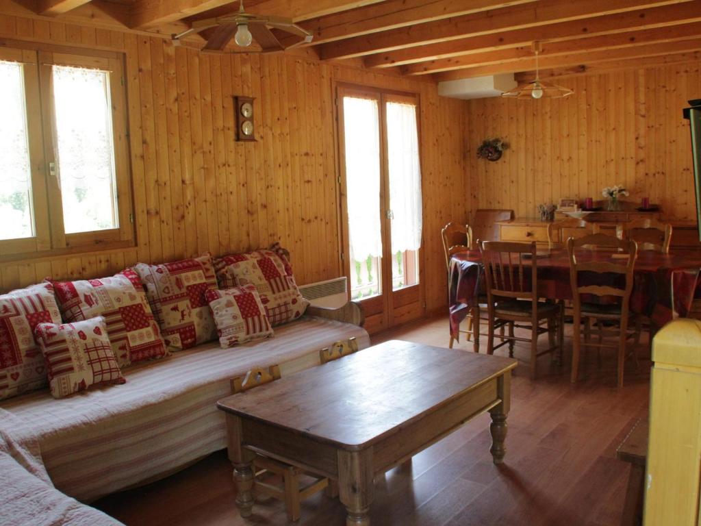 a living room with a couch and a table at Chalet Châtel, 5 pièces, 8 personnes - FR-1-200-212 in Châtel