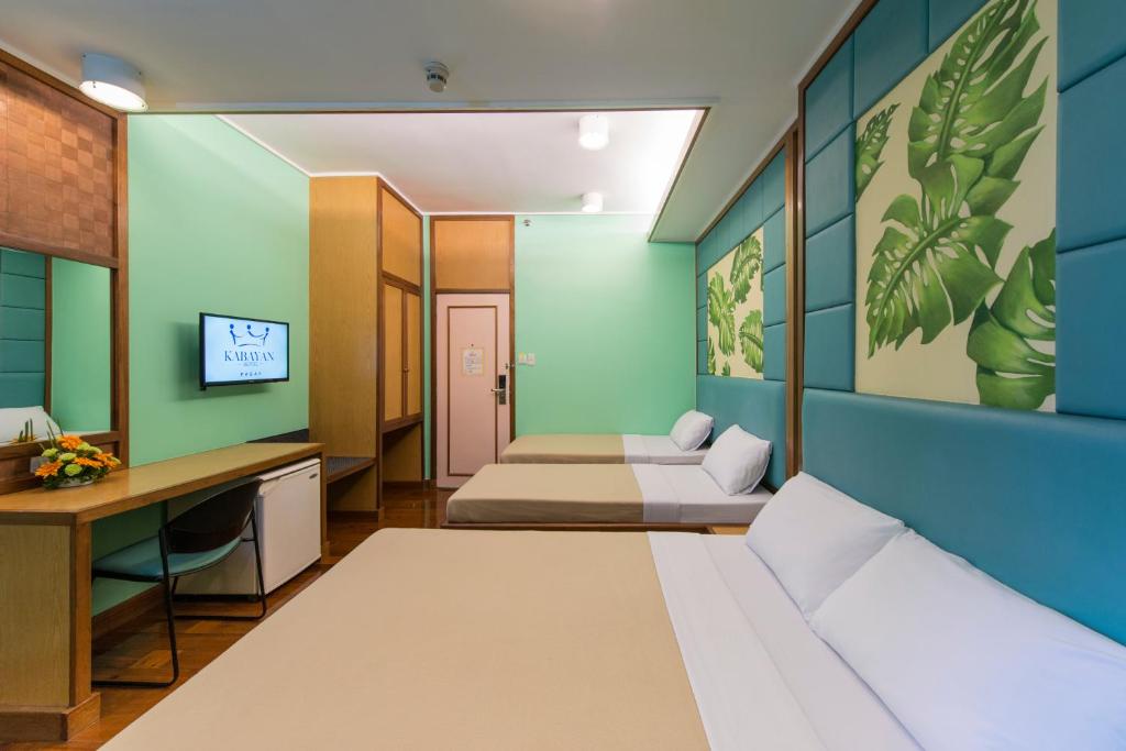 Kabayan Hotel Pasayにあるベッド