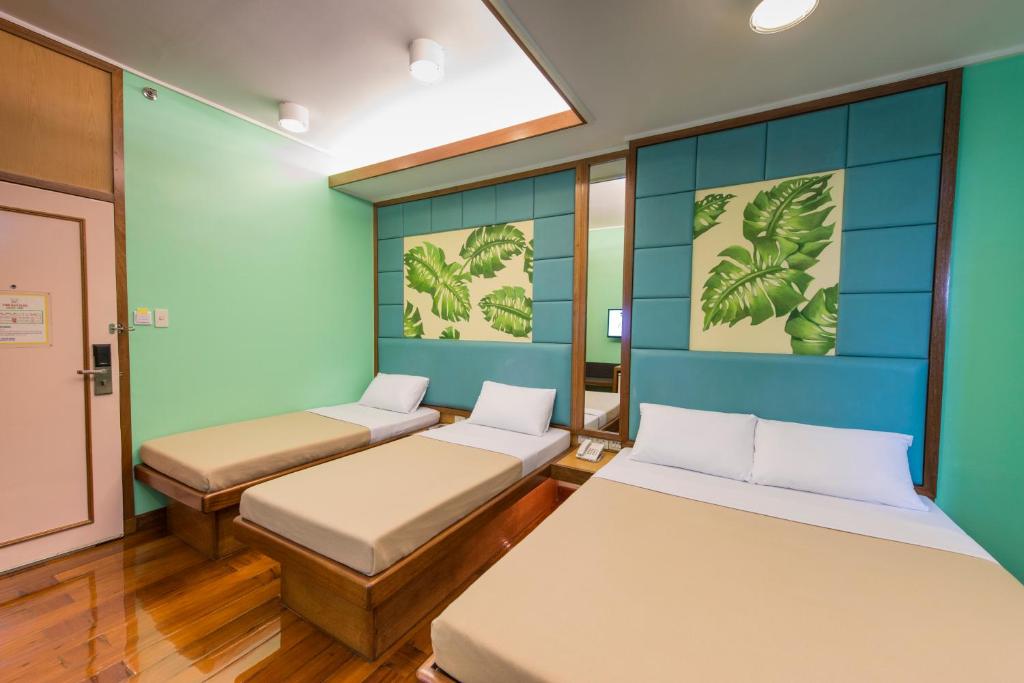 Kabayan Hotel Pasayにあるベッド