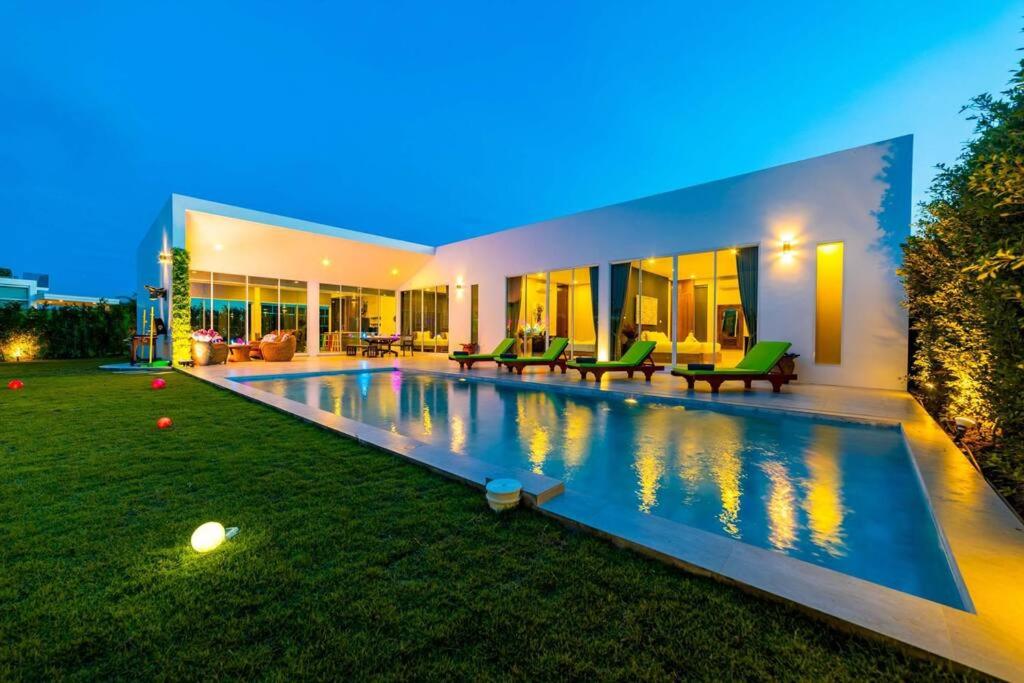 a house with a swimming pool in the yard at Modern Tropical 4 Bedroom Pool Villa KH-B5 in Khao Tao