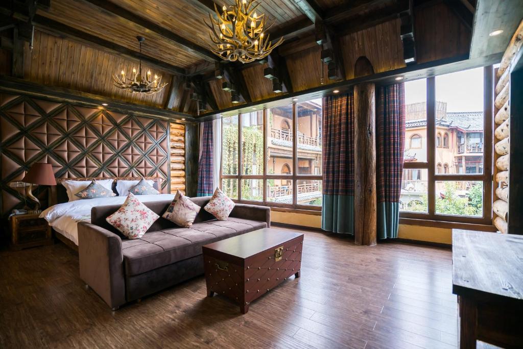 Postel nebo postele na pokoji v ubytování The Ritz-Man Boutique Inn Lijiang